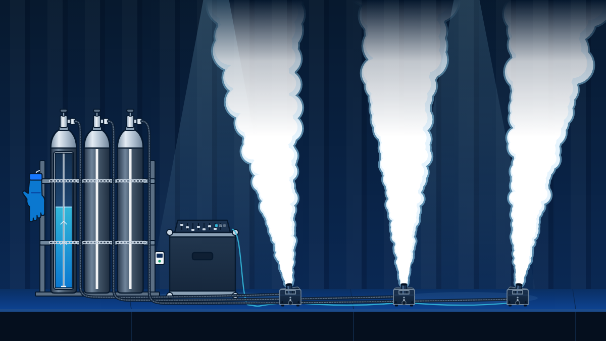 Stage with three siphon CO2 cylinders in a rack, one cut away to show the dip tube, feeding cryo jets that throw white plumes upward